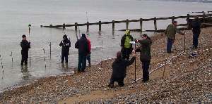 Birkbeck College surveying the beach as the tide comes in