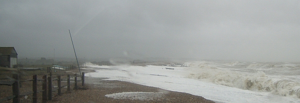 Waves pound the beach to the east of Normans Bay Outfall